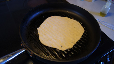 cooking the first side of the tortilla