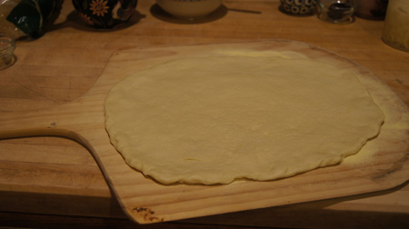 pizza dough on pizza peel
